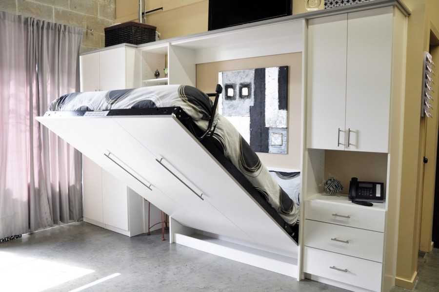 Современные двуспальные кровати-трансформеры – настоящее открытие для владельцев небольших квартир Кровать-диван и откидная от стены шкаф-кровать для малогабаритной квартиры – как выбрать Отзывы покупателей и красивые идеи для интерьера