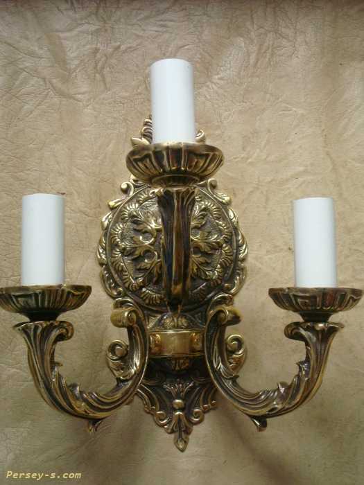 Бронзовые бра (28 фото): бронзовые настенные светильники в античном стиле в виде свечи